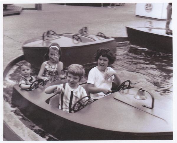 historic photo of kids on a boat ride from Kiddyland
