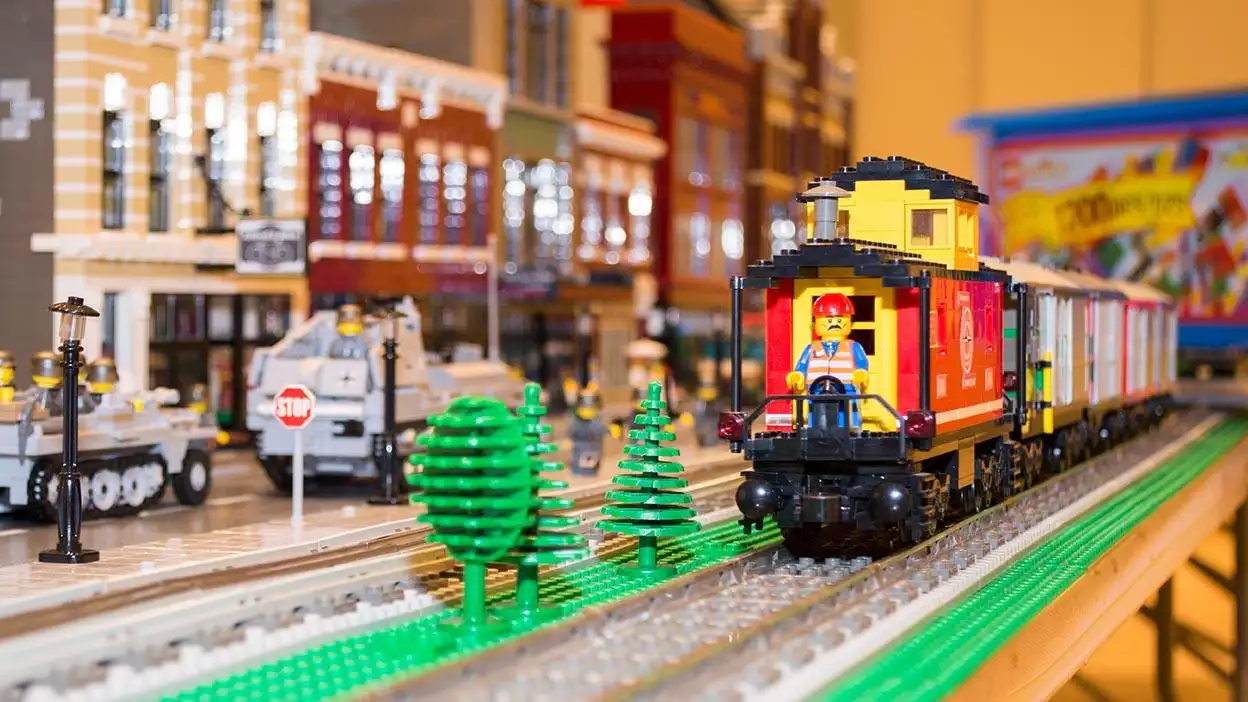 lego man on a lego train