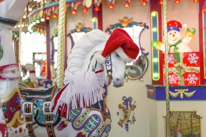 A carousel figure with hat and scarf.